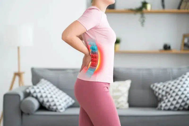 Woman experiencing lower back pain