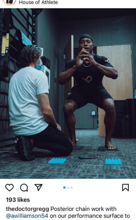 An athlete performs a squat exercise